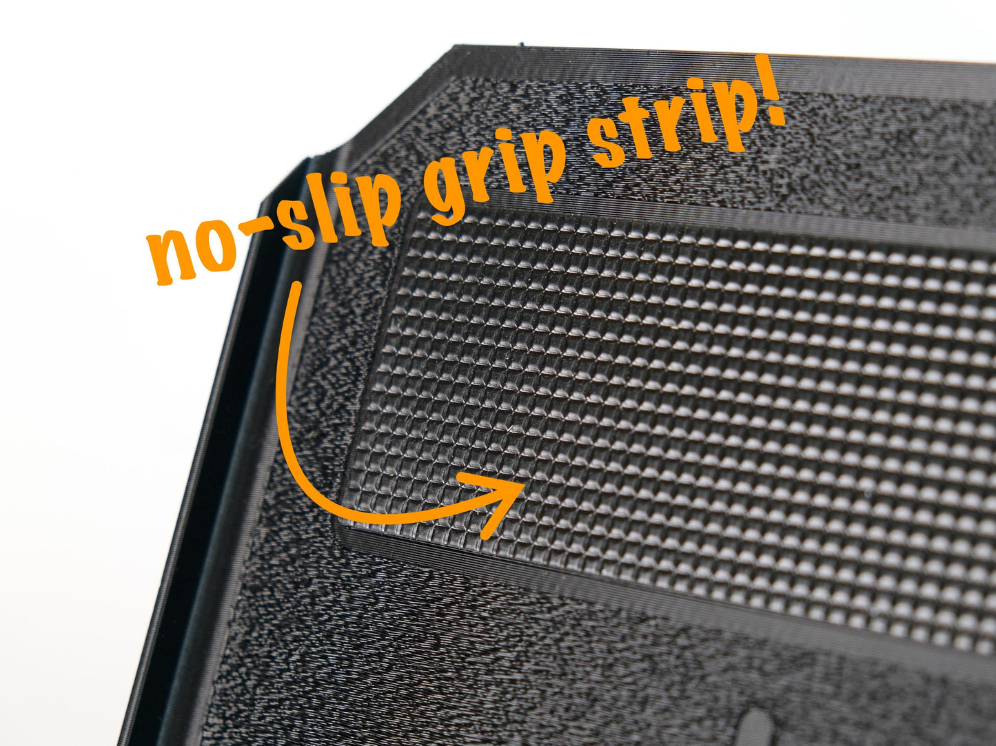 Close-up of a trainer tray with a no-slip grip strip highlighted.